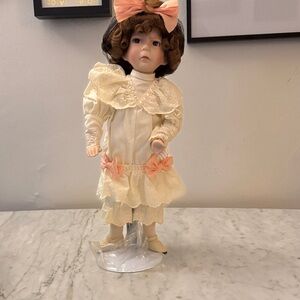 Porcelain Display Doll in Cream Dress with Pink Bows